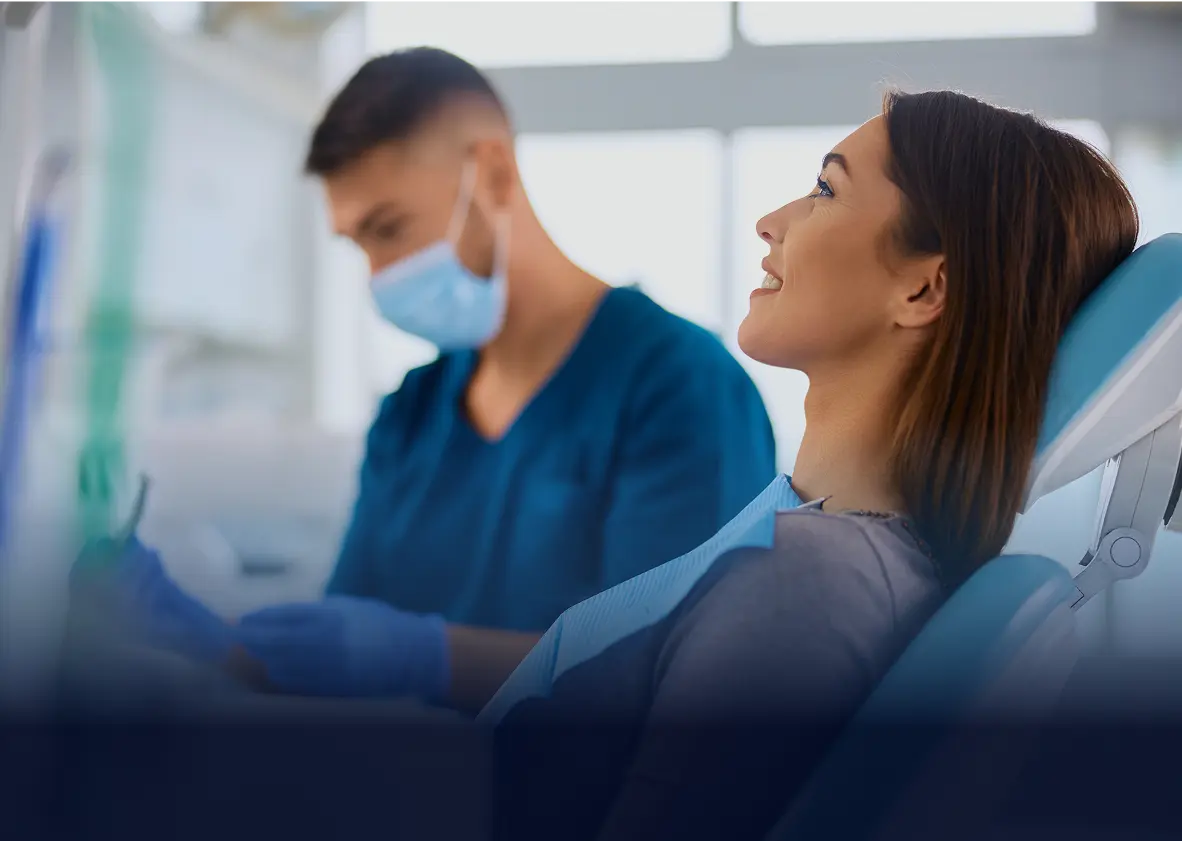 Woman smiling during dental check-up.